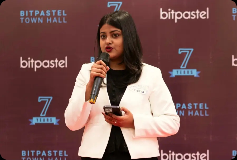 Bitpastel Townhall cake cutting with team members