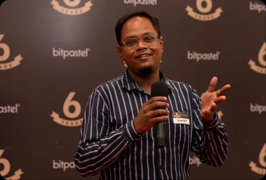 Bitpastel Townhall cake cutting with team members