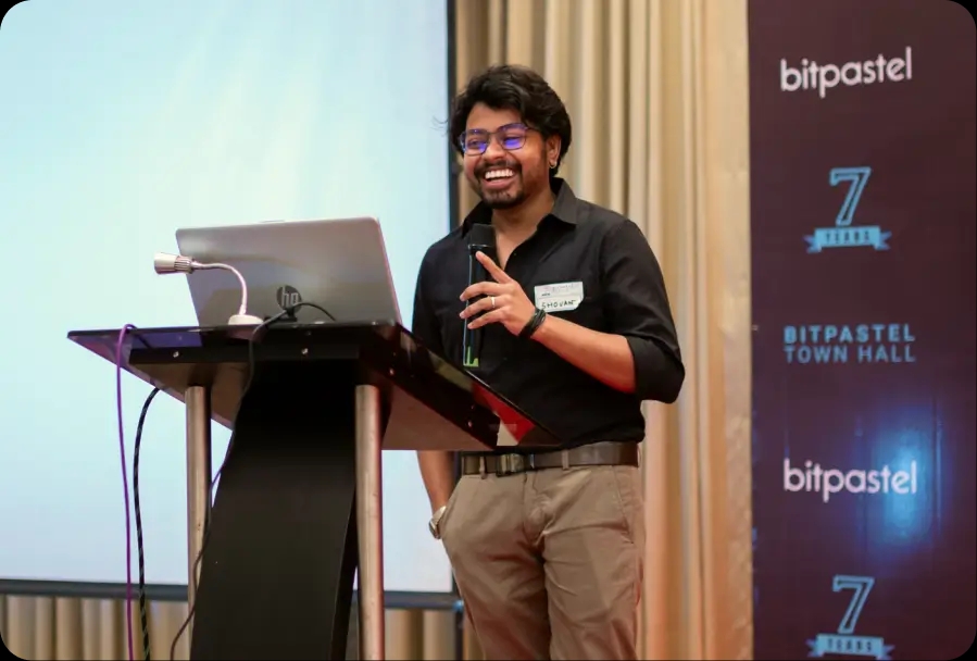 Bitpastel Townhall cake cutting with team members