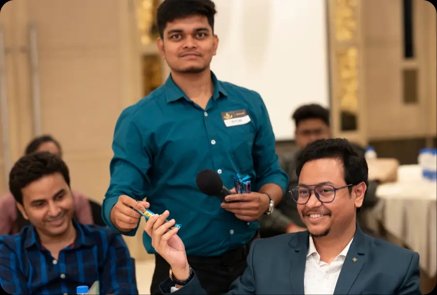 Bitpastel Townhall cake cutting with team members